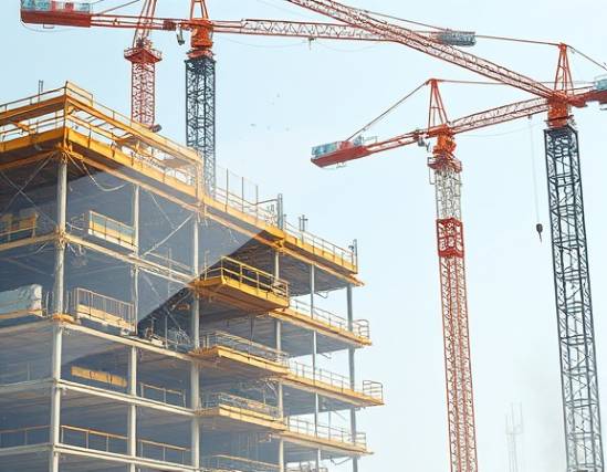 durable polycarbonate sheets, smooth texture, layering, photorealistic, construction site with cranes and scaffolding, highly detailed, dust particles suspended in air, 8k resolution, clear, natural daylight, shot with a wide-angle lens.